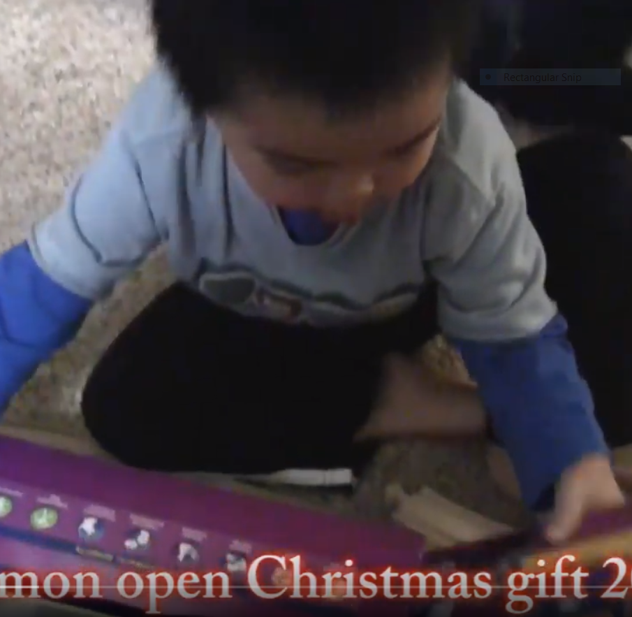 Simon open gifts on Christmas 2011